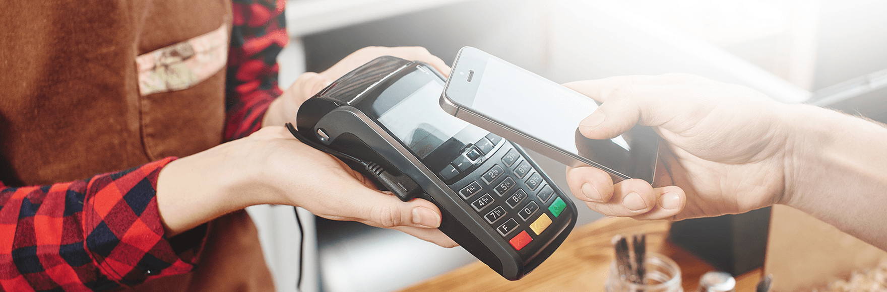 a person paying a bill with their mobile device